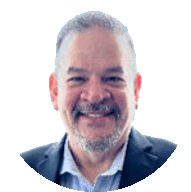 young man wearing shades and a hat with a beard, tattos and ear piercings